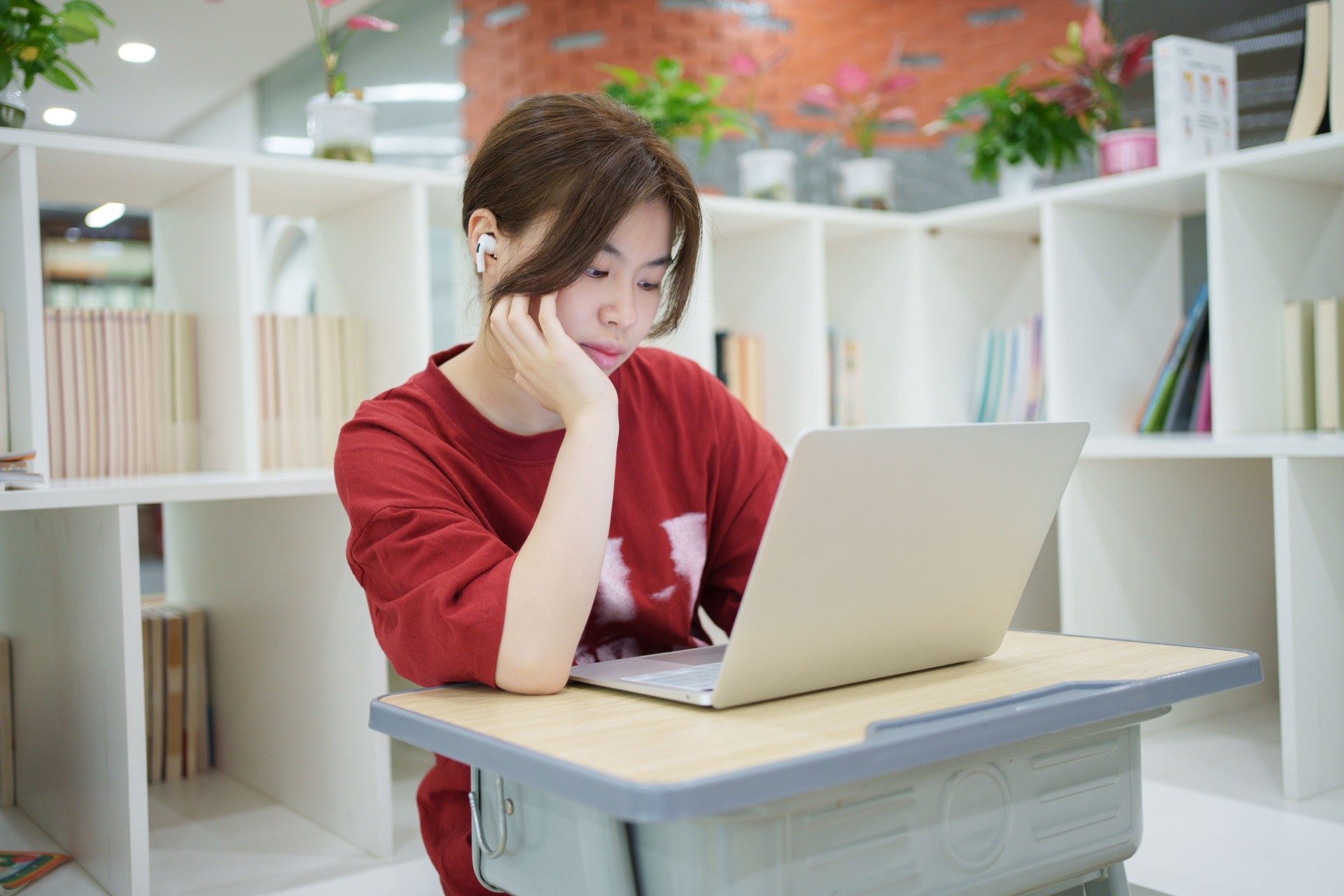 Asian female student browsing the Internet